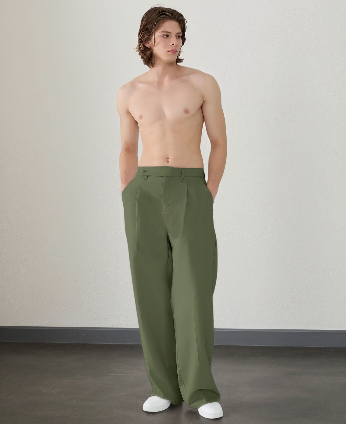 Wide leg silhouette of army green Men's Pleated Baggy Dress Pants comfortable fit with relaxed drape.