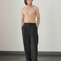 Wide leg silhouette of black Men's Pleated Baggy Dress Pants comfortable fit with relaxed drape.