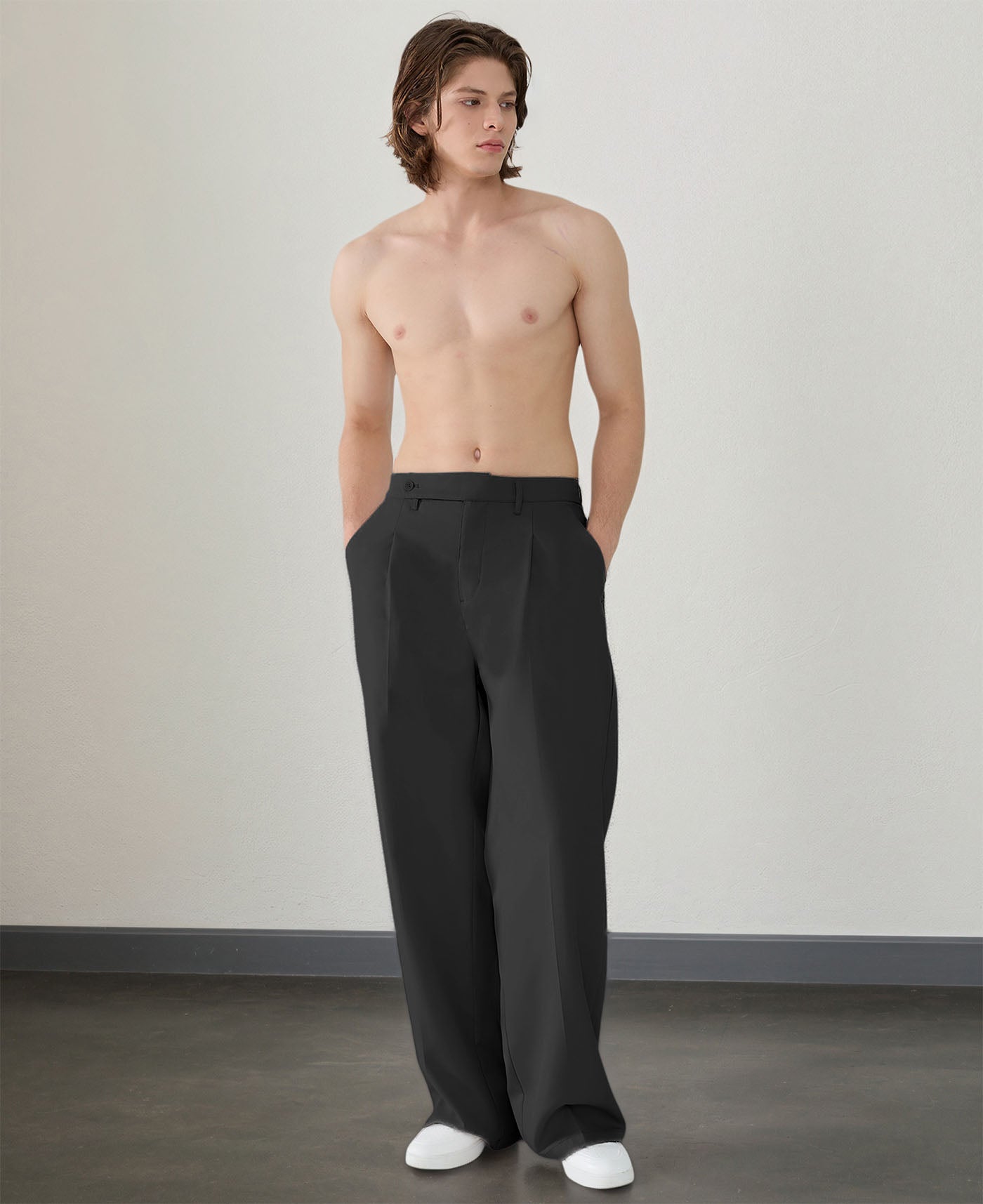 Wide leg silhouette of black Men's Pleated Baggy Dress Pants comfortable fit with relaxed drape.