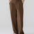Model showcasing brown Men's Pleated Baggy Dress Pants highlighting soft color and elegant drape.