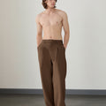 Wide leg silhouette of brown Men's Pleated Baggy Dress Pants comfortable fit with relaxed drape.