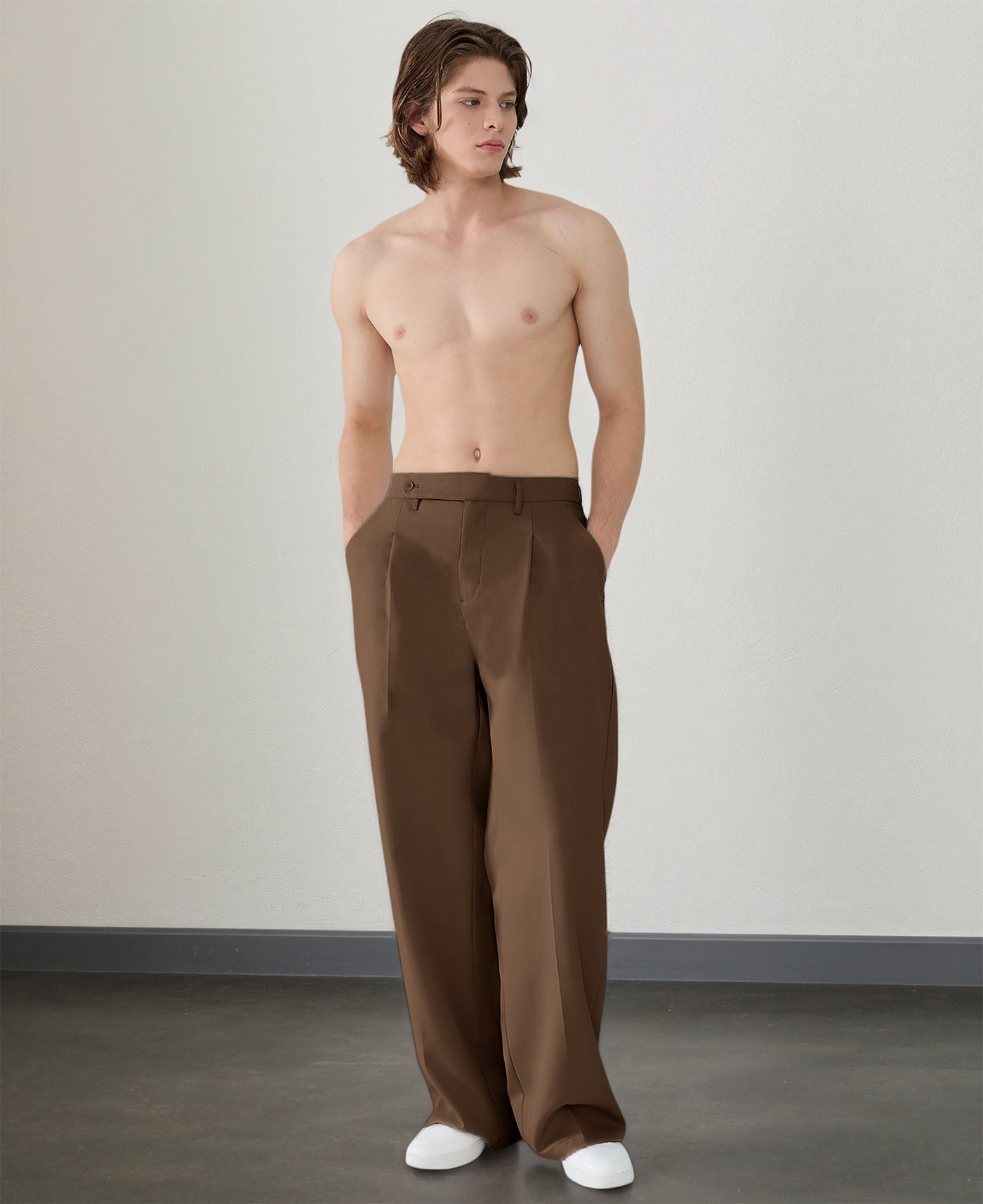 Wide leg silhouette of brown Men's Pleated Baggy Dress Pants comfortable fit with relaxed drape.