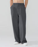 Model showcasing dark grey Men's Pleated Baggy Dress Pants highlighting soft color and elegant drape.