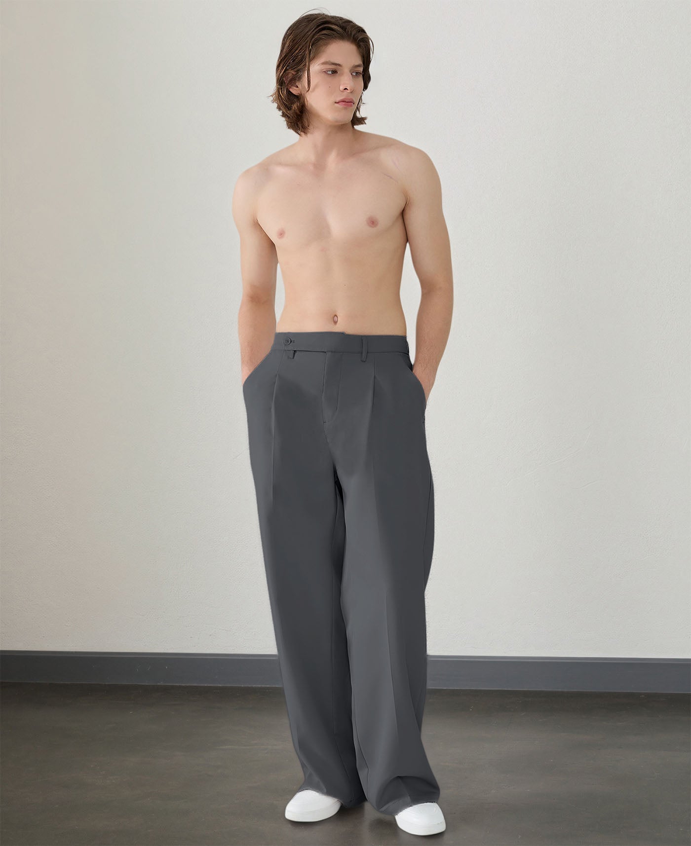 Wide leg silhouette of dark grey Men's Pleated Baggy Dress Pants comfortable fit with relaxed drape.