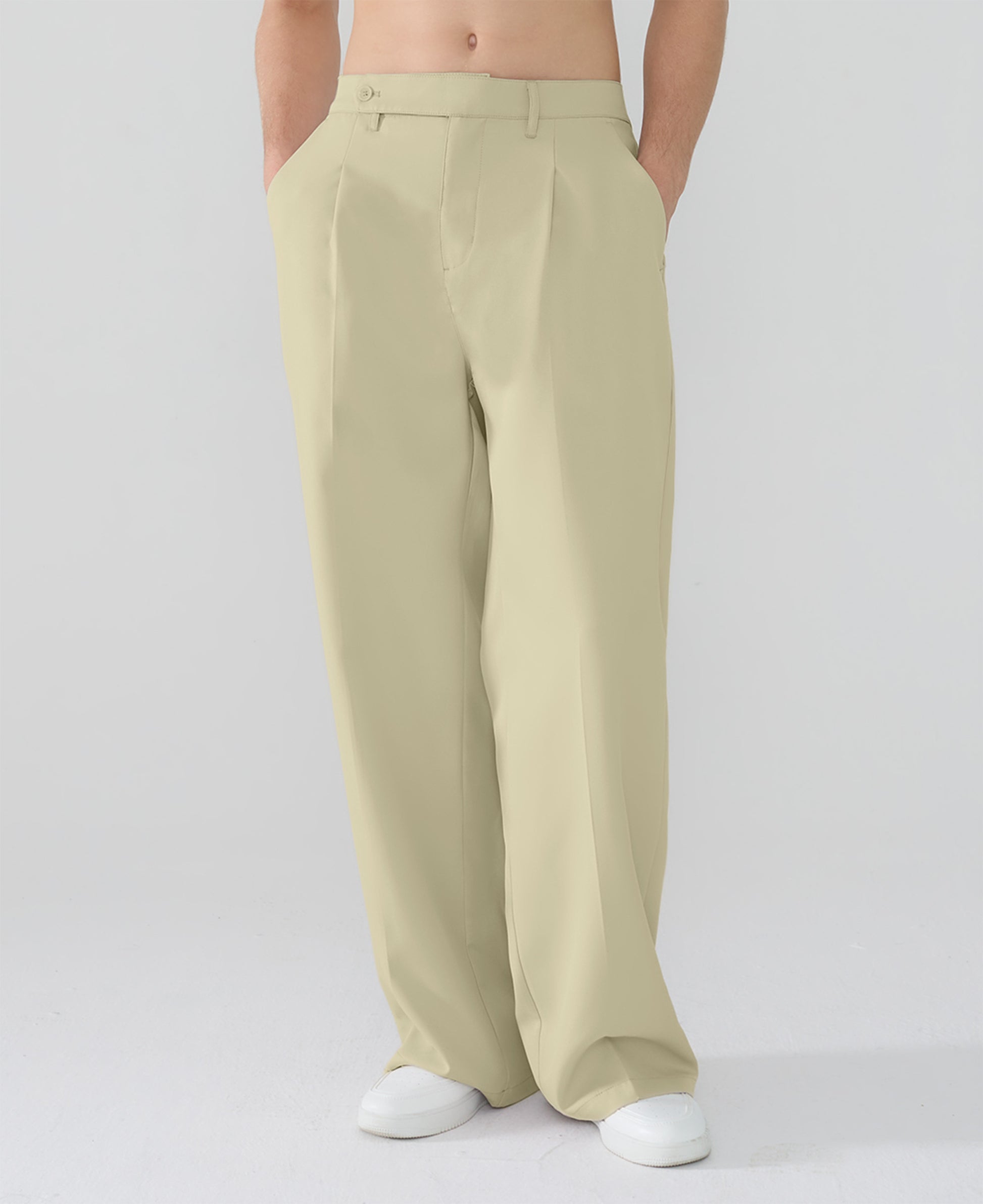 Model showcasing dark khaki Men's Pleated Baggy Dress Pants highlighting soft color and elegant drape.
