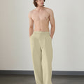 Wide leg silhouette of dark khaki Men's Pleated Baggy Dress Pants comfortable fit with relaxed drape.