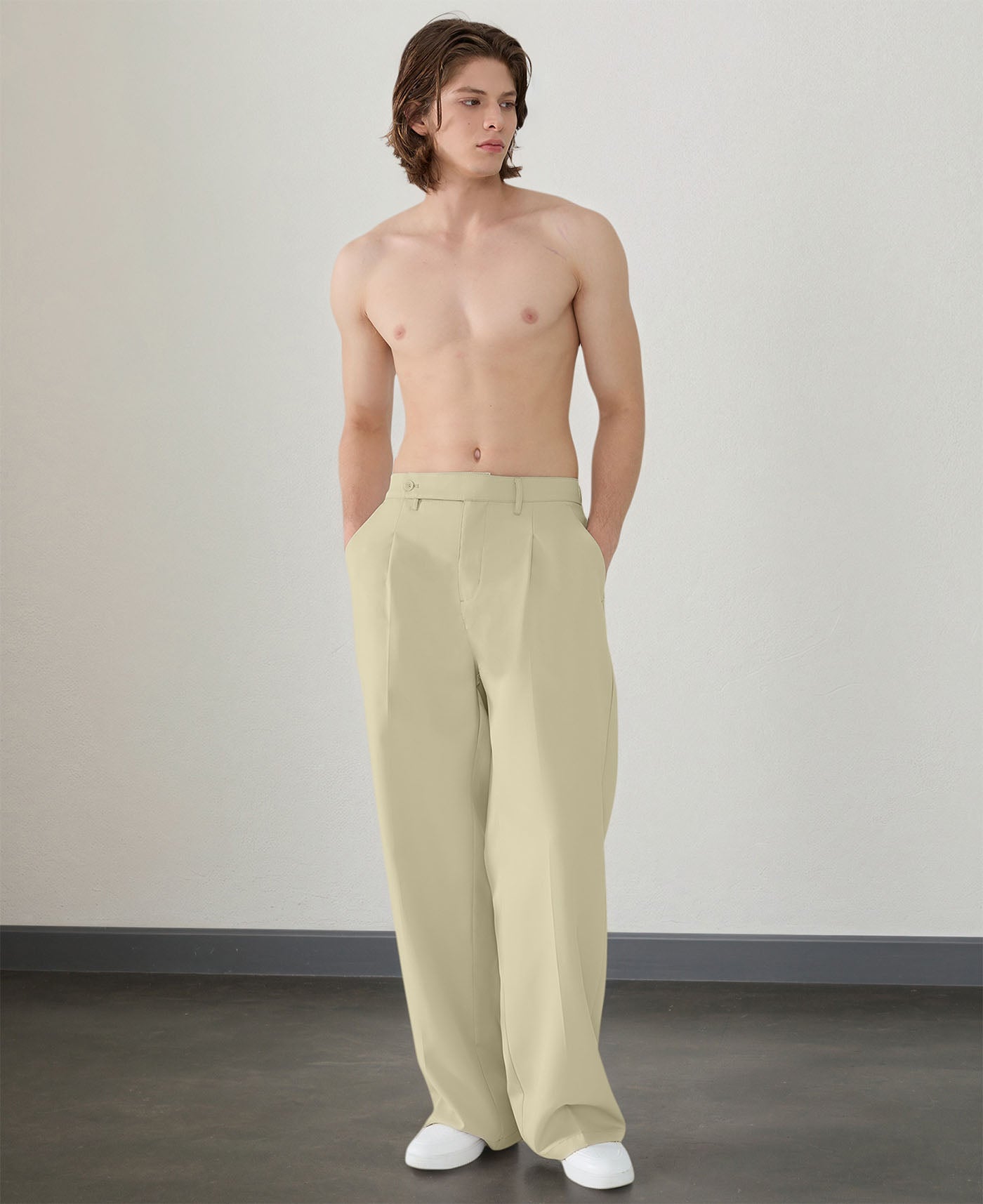 Wide leg silhouette of dark khaki Men's Pleated Baggy Dress Pants comfortable fit with relaxed drape.