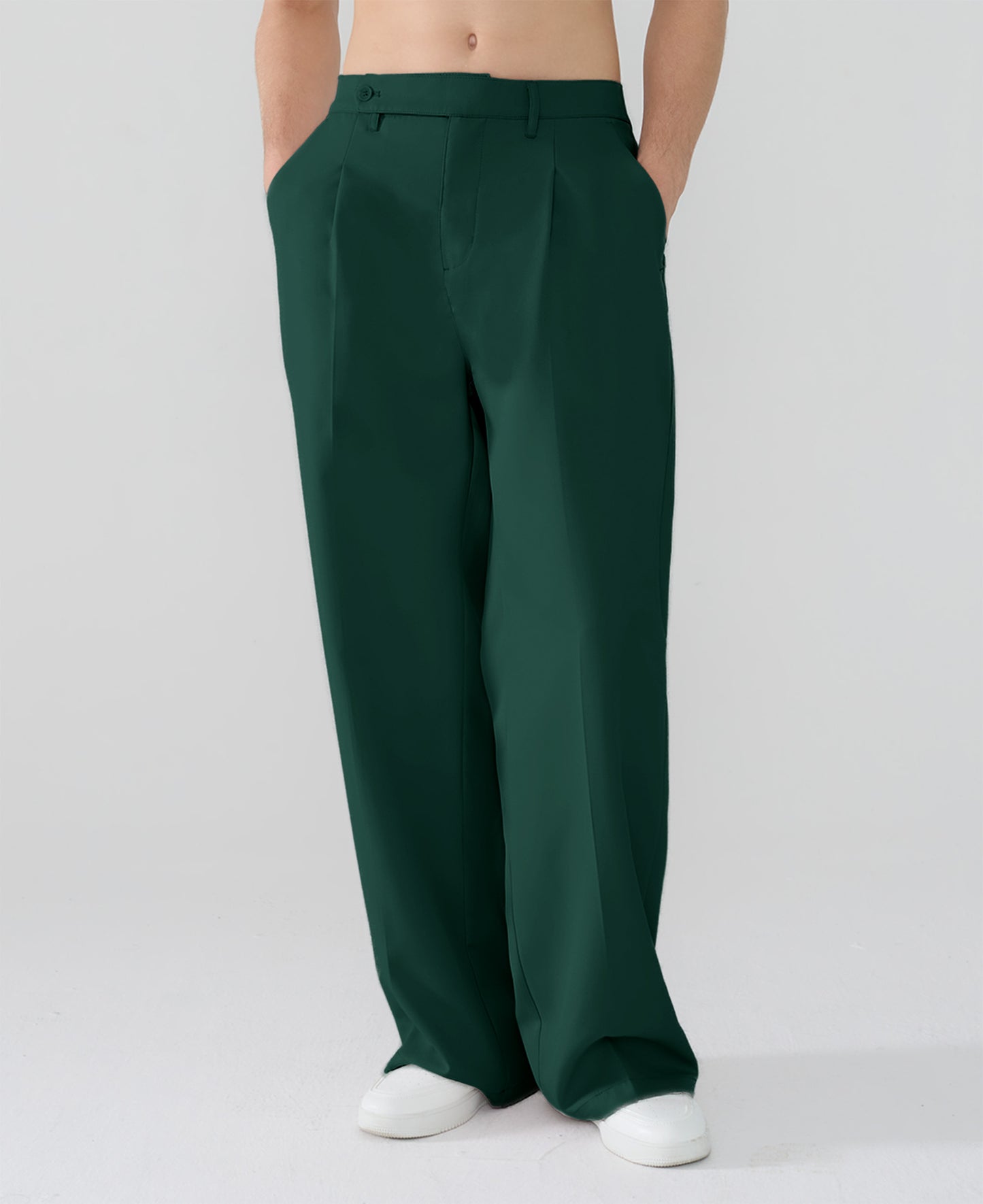 Model showcasing green Men's Pleated Baggy Dress Pants highlighting soft color and elegant drape.