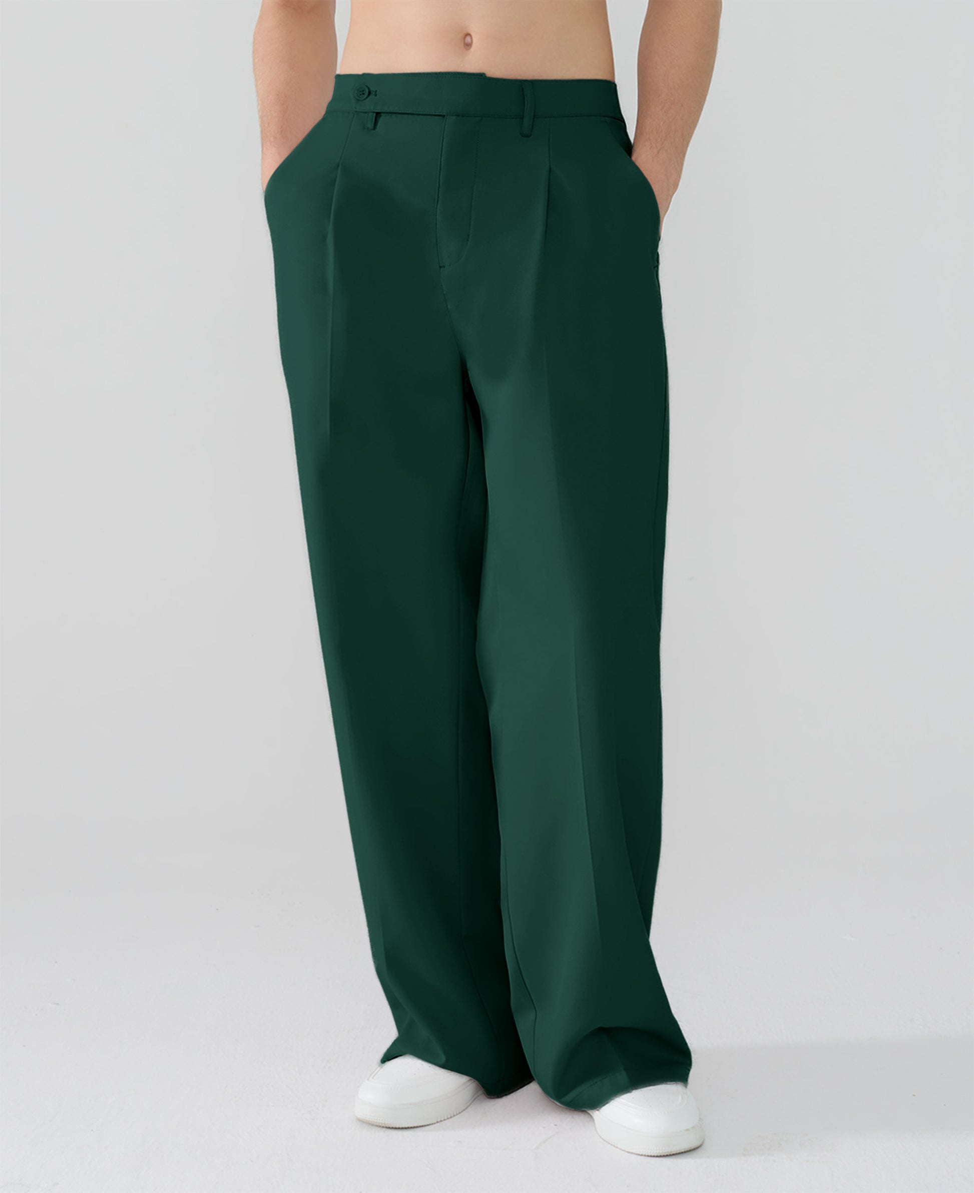 Model showcasing green Men's Pleated Baggy Dress Pants highlighting soft color and elegant drape.