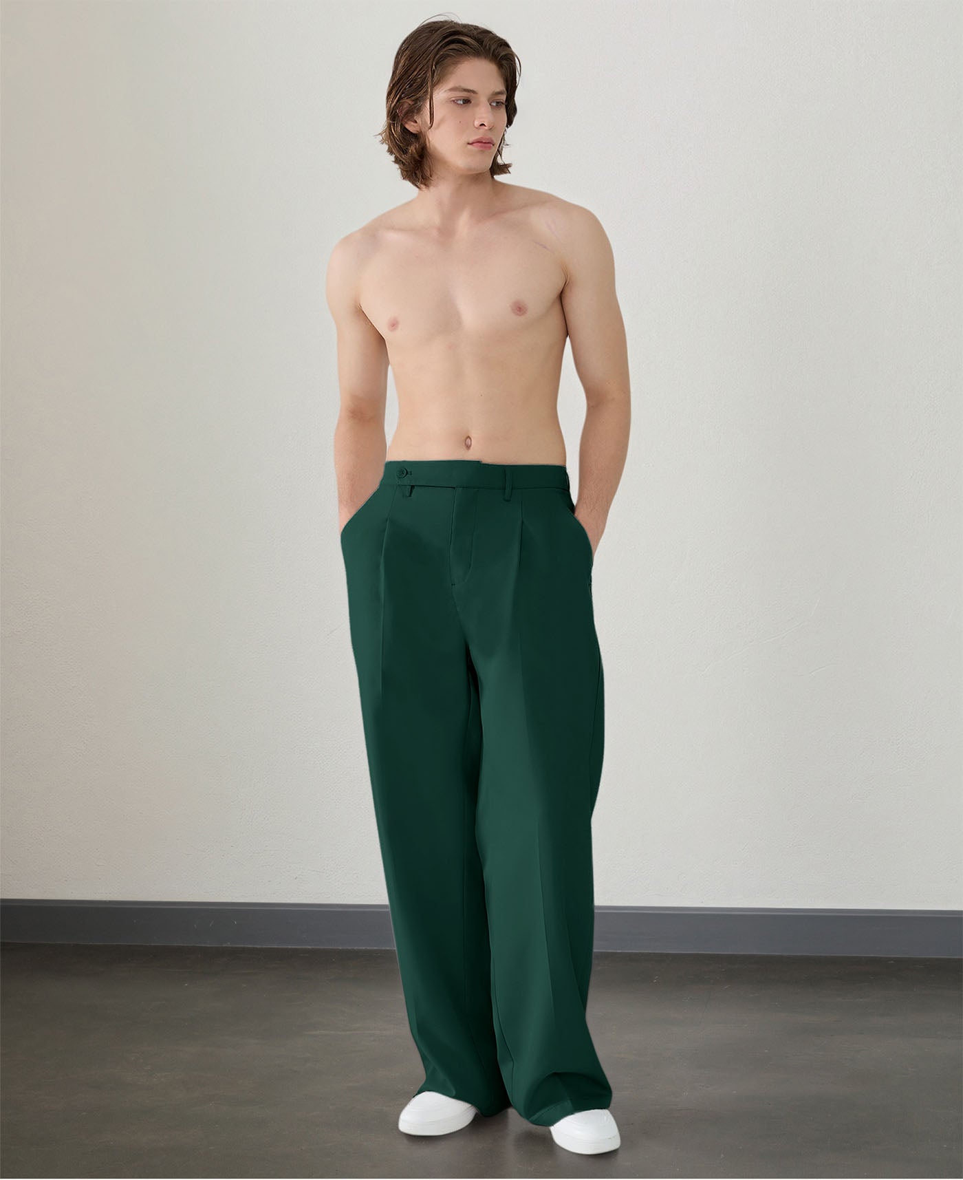 Wide leg silhouette of green Men's Pleated Baggy Dress Pants comfortable fit with relaxed drape.