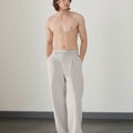 Wide leg silhouette of light gray Men's Pleated Baggy Dress Pants comfortable fit with relaxed drape.