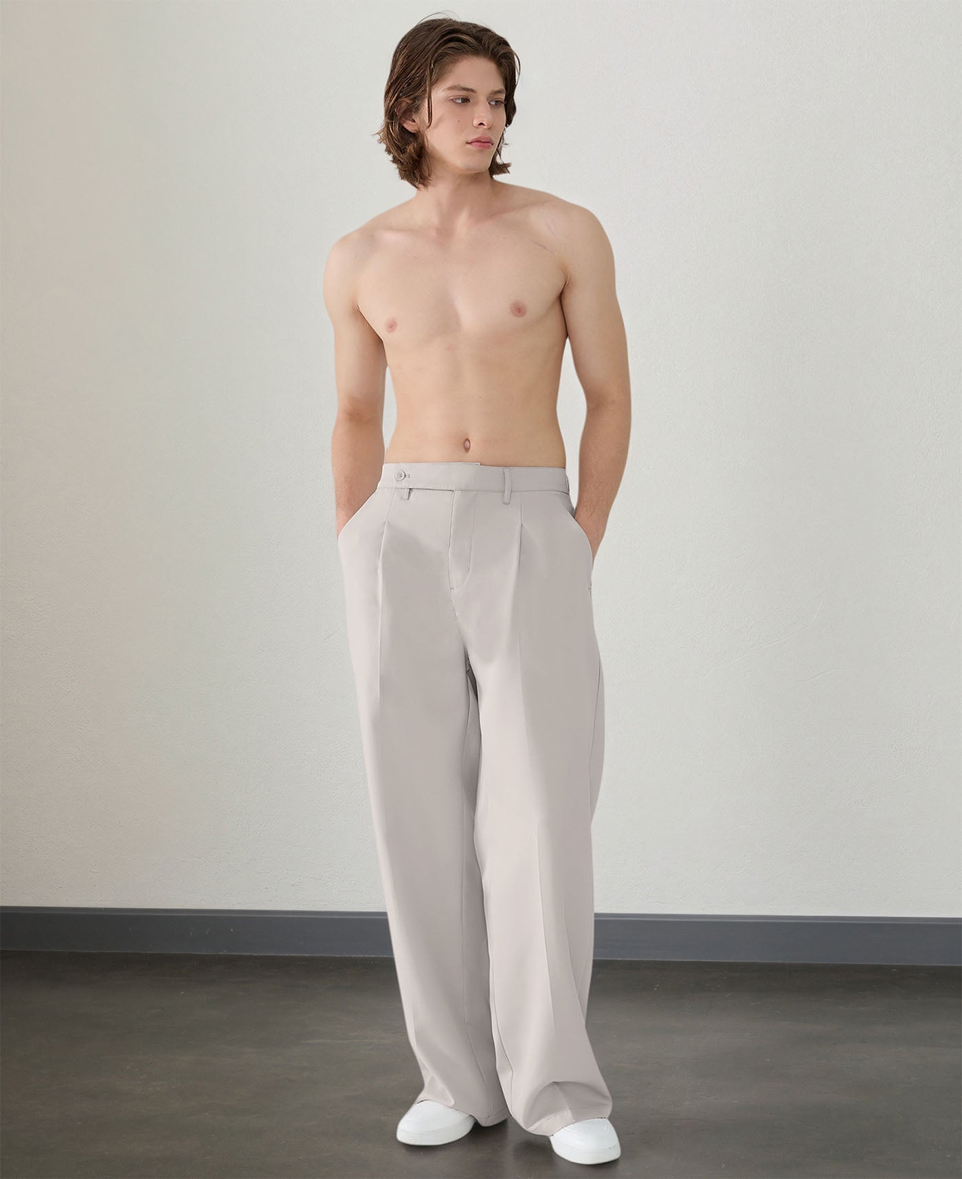 Wide leg silhouette of light gray Men's Pleated Baggy Dress Pants comfortable fit with relaxed drape.
