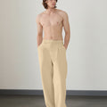 Wide leg silhouette of light khaki Men's Pleated Baggy Dress Pants comfortable fit with relaxed drape.