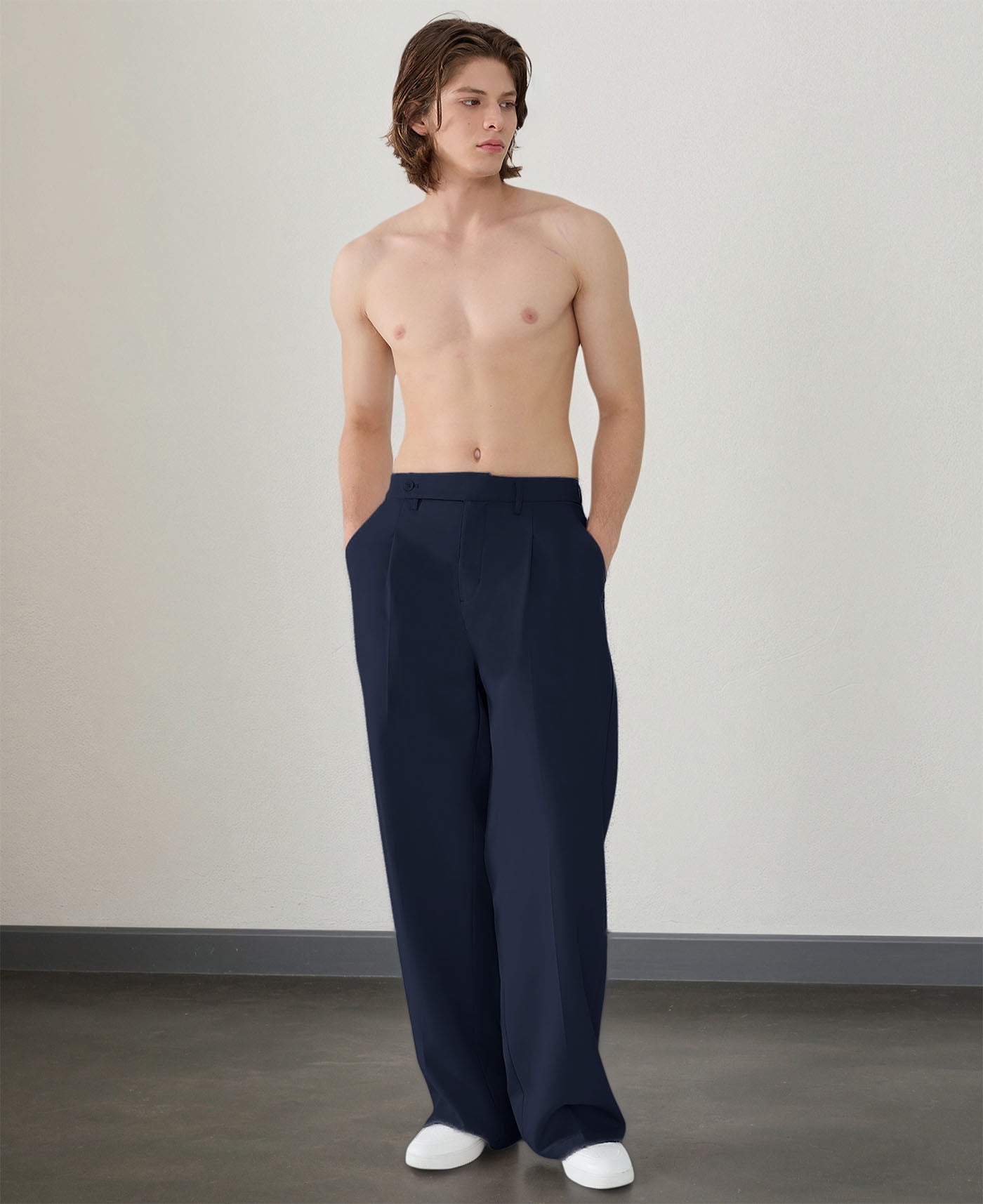 Wide leg silhouette of navy blue Men's Pleated Baggy Dress Pants comfortable fit with relaxed drape.