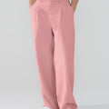 Model showcasing pink Men's Pleated Baggy Dress Pants highlighting soft color and elegant drape.