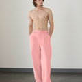 Wide leg silhouette of pink Men's Pleated Baggy Dress Pants comfortable fit with relaxed drape.