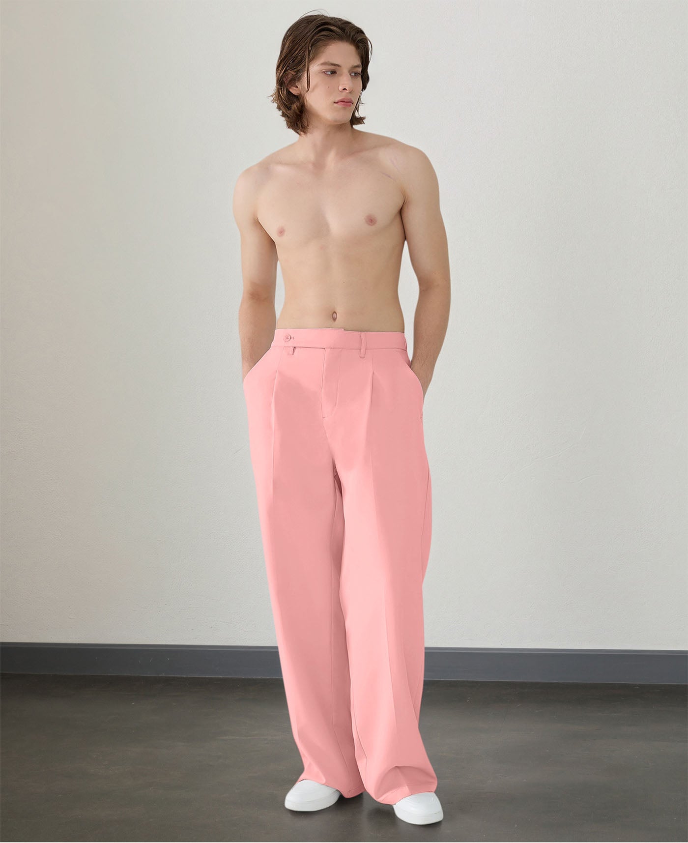 Wide leg silhouette of pink Men's Pleated Baggy Dress Pants comfortable fit with relaxed drape.