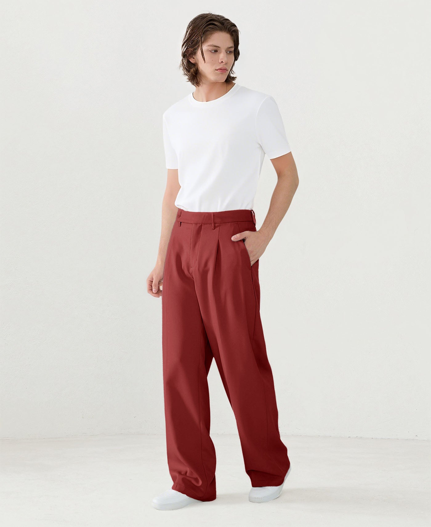 Model in white tee paired with red Men's Pleated Baggy Dress Pants showing fresh casual style.