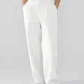 Model showcasing white Men's Pleated Baggy Dress Pants highlighting soft color and elegant drape.