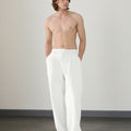 Wide leg silhouette of white Men's Pleated Baggy Dress Pants comfortable fit with relaxed drape.