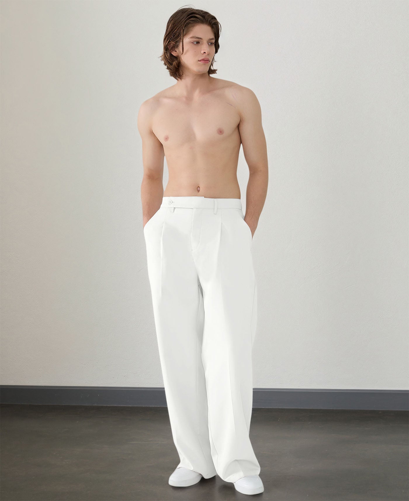 Wide leg silhouette of white Men's Pleated Baggy Dress Pants comfortable fit with relaxed drape.