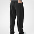 Back view of black pants showing rear pocket and overall silhouette, man with hand in back pocket for storage detail.