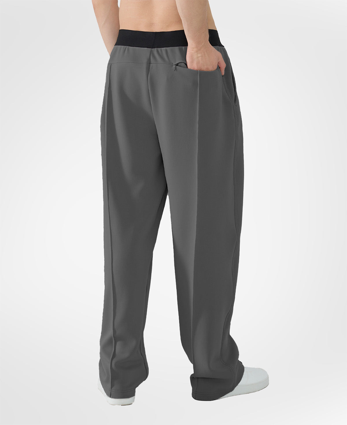 Back view of dark grey pants showing rear pocket and overall silhouette, man with hand in back pocket for storage detail.