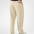 Back view of khaki pants showing rear pocket and overall silhouette, man with hand in back pocket for storage detail.