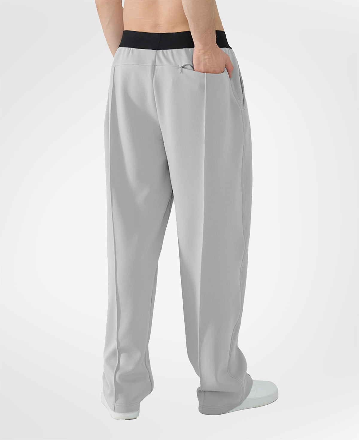 Back view of light grey pants showing rear pocket and overall silhouette, man with hand in back pocket for storage detail.