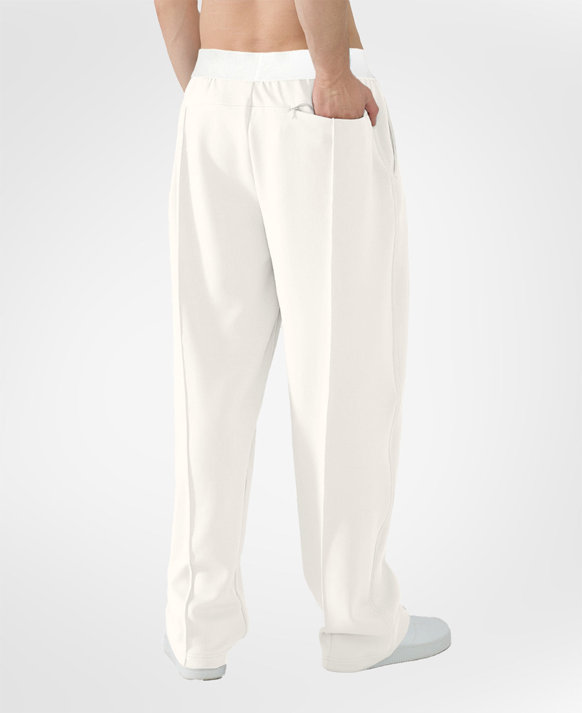 Back view of white pants showing rear pocket and overall silhouette, man with hand in back pocket for storage detail.