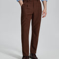 Man in light blue shirt, coffee Mens Pleated Dress Pants, and brown shoes showcasing regular fit & straight-leg style.