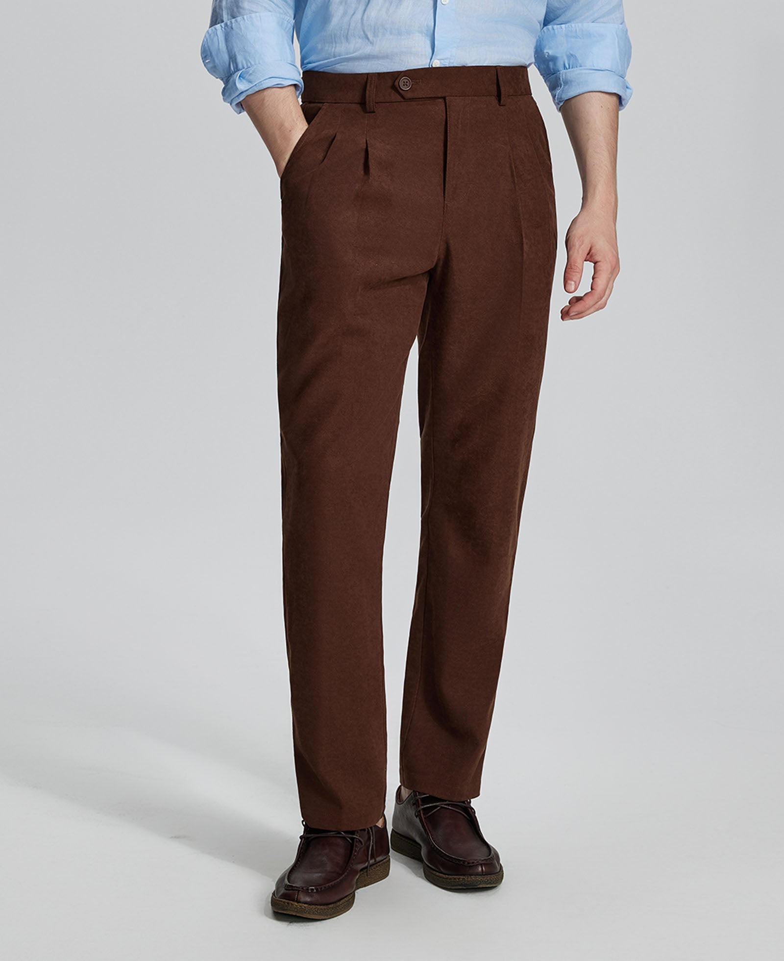 Man in light blue shirt, coffee Mens Pleated Dress Pants, and brown shoes showcasing regular fit & straight-leg style.