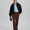 Model in coffee blazer, light blue shirt, and Mens Pleated Dress Pants showing smart business casual outfit with regular fit trousers.