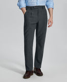 Man in light blue shirt, grey Mens Pleated Dress Pants, and brown shoes showcasing regular fit & straight-leg style.