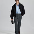 Model in grey blazer, light blue shirt, and Mens Pleated Dress Pants showing smart business casual outfit with regular fit trousers.