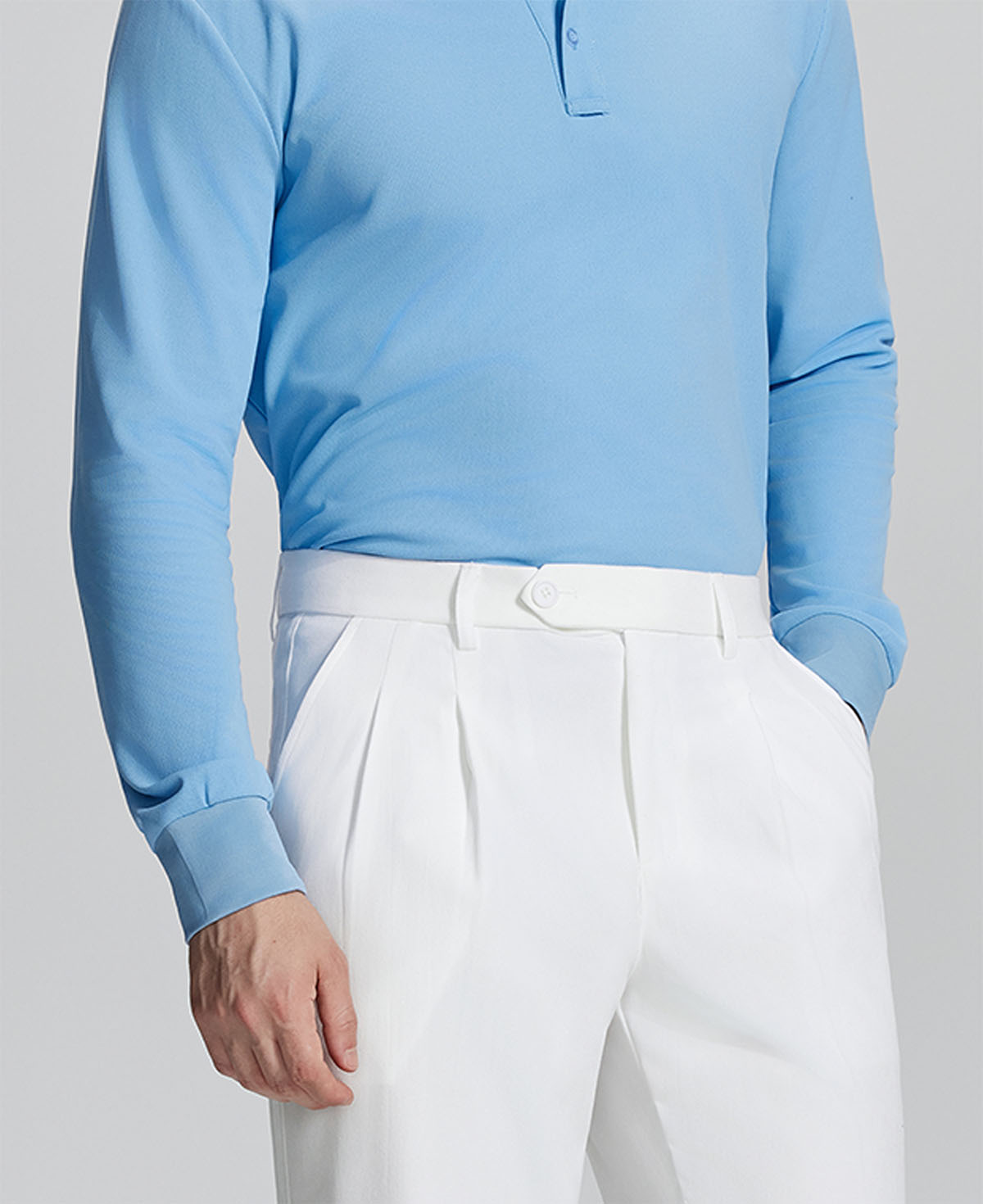 Close-up of waistband on Mens Pleated Dress Pants, highlighting button closure and tailored pleats for a refined look.