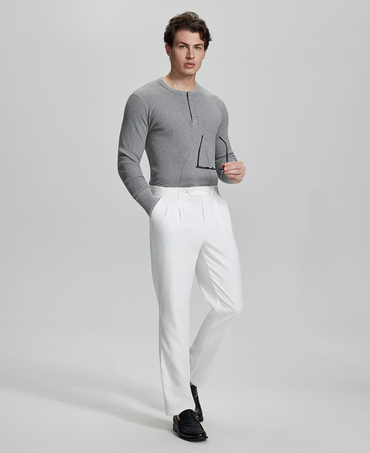 Model in white blazer, light blue shirt, and Mens Pleated Dress Pants showing smart business casual outfit with regular fit trousers.