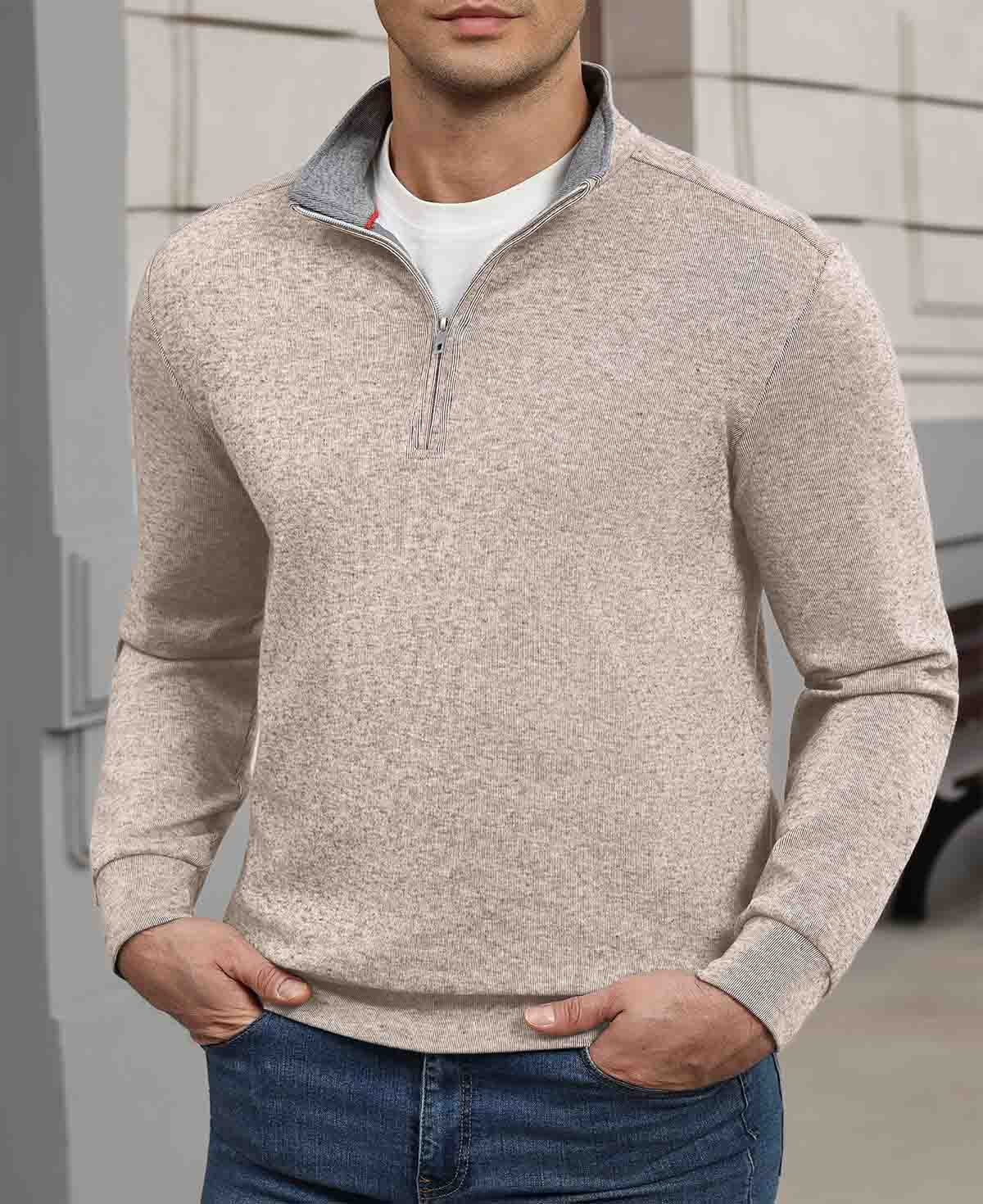 Indoor setting: model wearing apricot Men's Quarter Zip Sweater, highlighting practical quarter-zip design for casual wear.