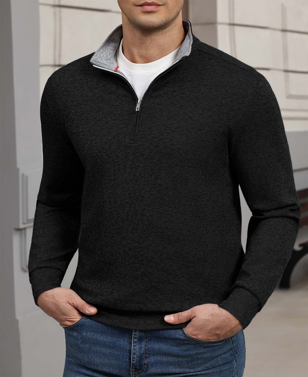 Indoor setting: model wearing black Men's Quarter Zip Sweater, highlighting practical quarter-zip design for casual wear.