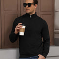 Model holding coffee in black Men's Quarter Zip Sweater, comfortable look for light casual settings.