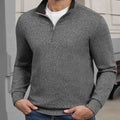 Indoor setting: model wearing grey Men's Quarter Zip Sweater, highlighting practical quarter-zip design for casual wear.