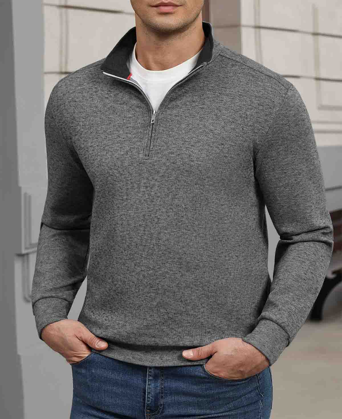 Indoor setting: model wearing grey Men's Quarter Zip Sweater, highlighting practical quarter-zip design for casual wear.