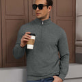 Model holding coffee in grey Men's Quarter Zip Sweater, comfortable look for light casual settings.