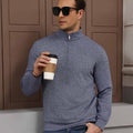 Model holding coffee in navy blue Men's Quarter Zip Sweater, comfortable look for light casual settings.