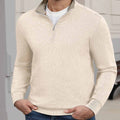 Indoor setting: model wearing white Men's Quarter Zip Sweater, highlighting practical quarter-zip design for casual wear.