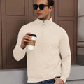 Model holding coffee in white Men's Quarter Zip Sweater, comfortable look for light casual settings.