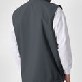 Back view of dark grey Men's Softshell Vest ¨C clean, streamlined silhouette with minimalist design and flexible fit.