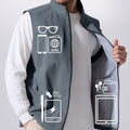 Pockets on light grey Men's Softshell Vest hold phone, sunglasses, ID, practical storage for daily or outdoor use.