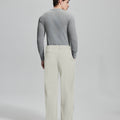 Back view of apricot wide-leg corduroy pants, showing overall silhouette and rear pocket design for comfort and style.