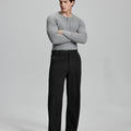 Model in gray sweater with black wide-leg corduroy pants, showcasing casual yet neat daily wear styling.